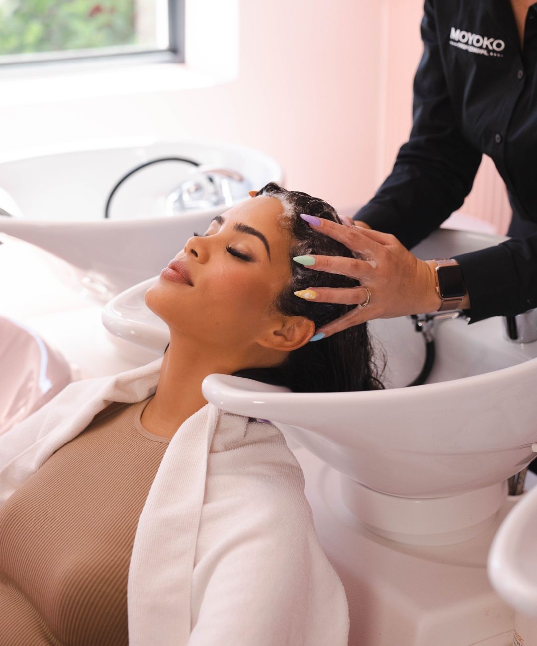Client receiving relaxing scalp massage