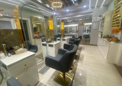 A view inside KM Orgatonics, a modern salon and clinic in Gorakhpur, showing styling stations, makeup displays, and a spacious interior.