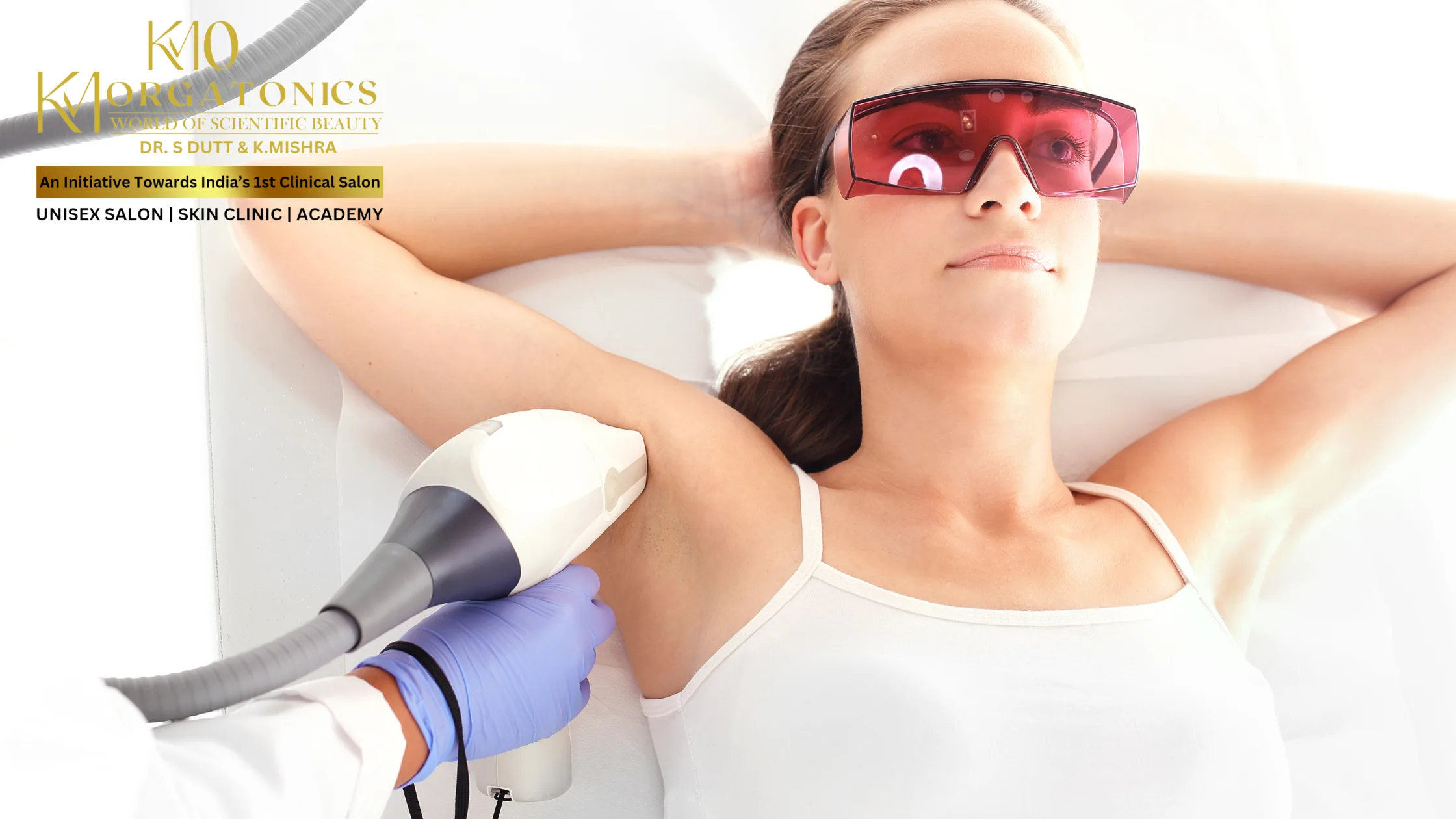 A woman receiving underarm laser hair removal treatment at KM Orgatonics in Gorakhpur, wearing protective eyewear.