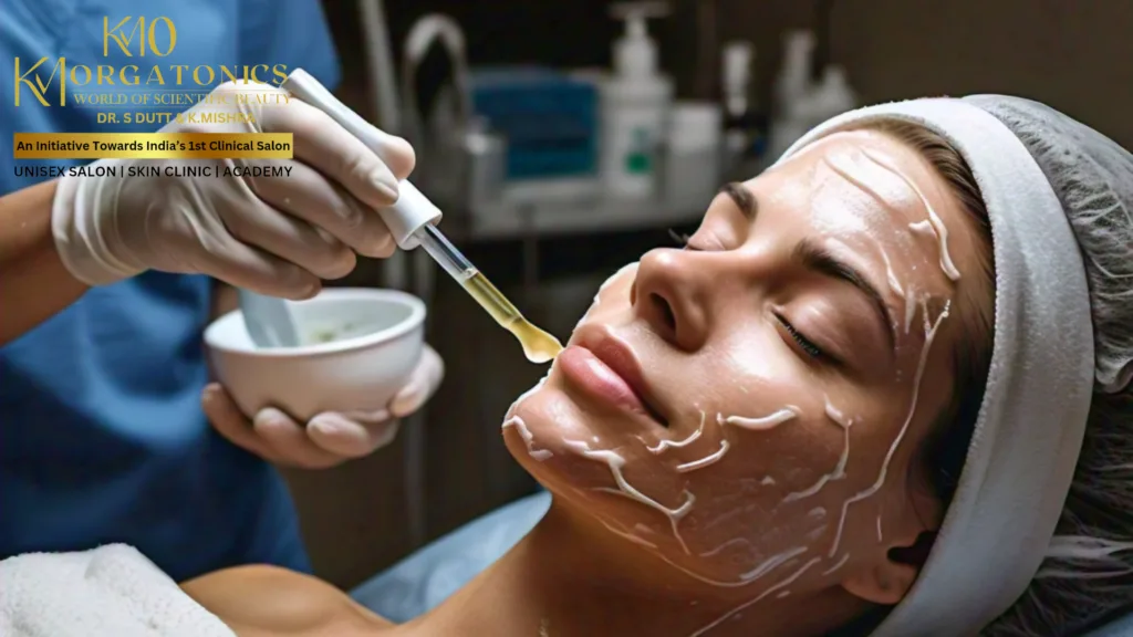 A client receives a chemical peel treatment at KM Orgatonics, Gorakhpur. A skincare professional applies the peel solution to the client's face.